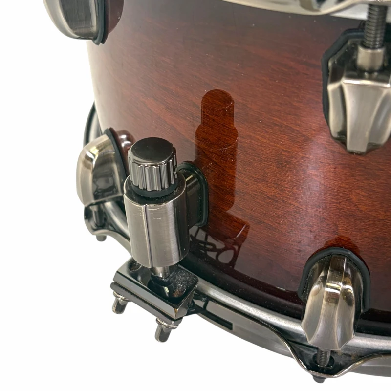 Close-up of a professional wooden drum with hardware and tuning knob. Perfect for drummers seeking q.