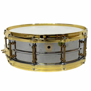 Vintage snare drum with chrome finish and gold hardware, ideal for professional drummers and percuss.