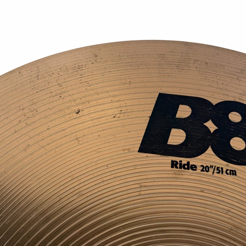 Drummers Only logo featuring a wooden drum surface and drumsticks.