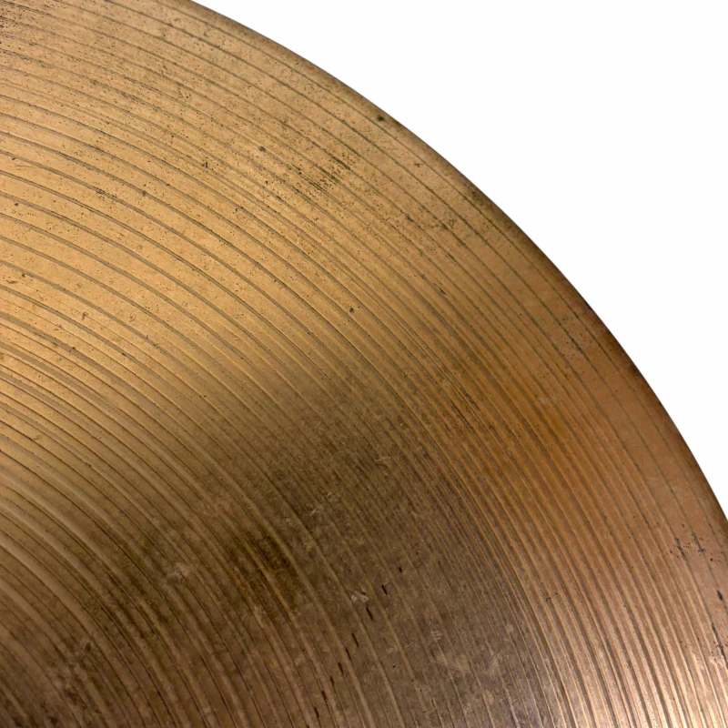 Close-up of a cymbal with Drummers Only branding for drum equipment and accessories.