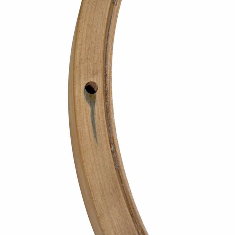 Wooden drum rim for percussion instruments, close-up shot.