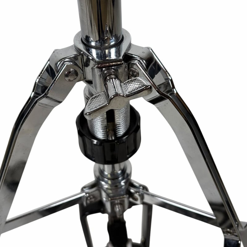 Close-up of a professional drum stool stand with adjustable height mechanism.