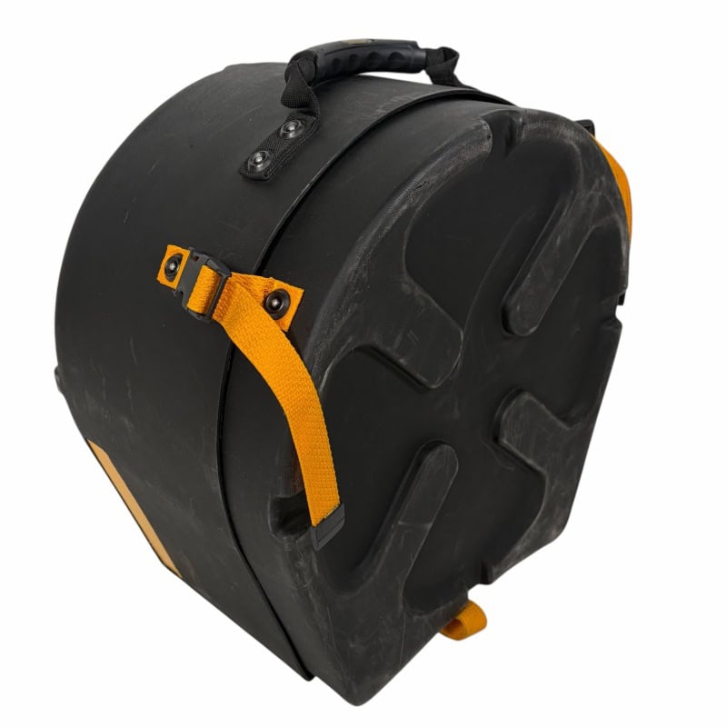 Durable black drum case with yellow strap for secure transport.