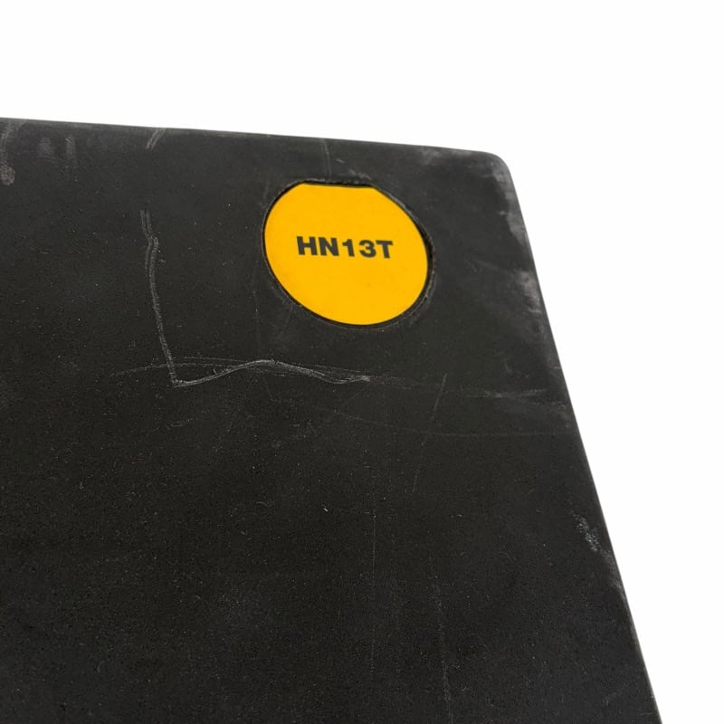 Close-up of drum accessory label with "HN13T" marking for drummers.