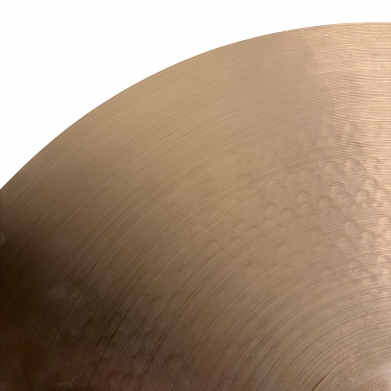 Close-up of a bronze drum cymbal for drummers and percussionists.