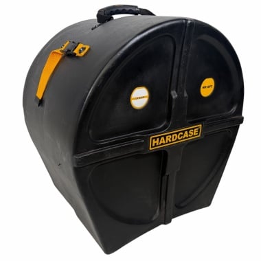 Heavy-duty black drum hardcase with yellow strap and handle for secure transport.
