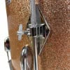 Close-up of drum hardware on a glittery drum shell.