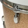 Close-up of a Gretsch drum shell with hardware and textured finish.