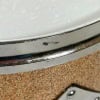 Close-up of Gretsch USA drum shell with chrome hardware and textured finish.