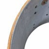 Close-up of drum shell with metal hardware and wood edge detail.