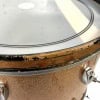 Close-up of a vintage drum shell with rust and wear details.