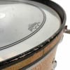 Close-up of a Gretsch drum shell with visible wear and tear.