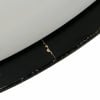 Close-up of a drum shell with black finish and minor scratches.
