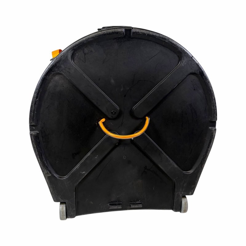 Heavy-duty black drum case with orange handle for secure transport.