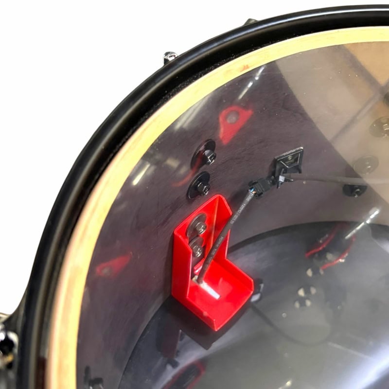 Wall clock with drumstick design for musicians.