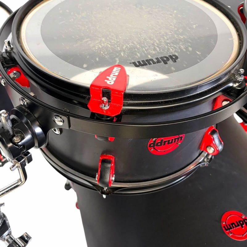 High-quality drum kit with black and red accents, perfect for professional drummers.