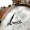 Close-up of Sonor Vintage Series bass drum with logo and wood finish.