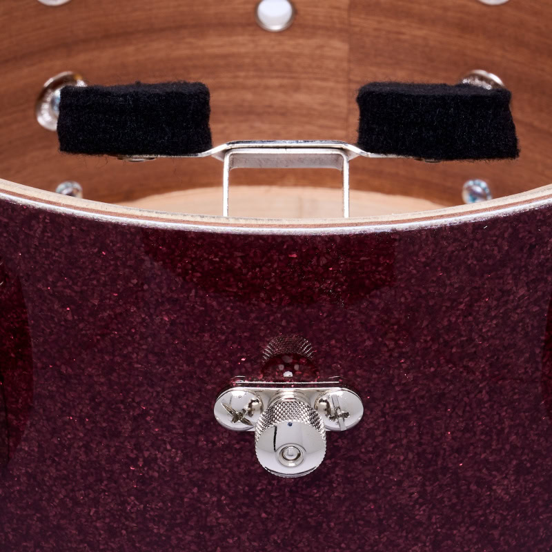 Close-up of a drum practice pad with drumsticks resting on it, ideal for drummers' practice sessions.
