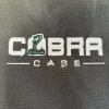 Cobra 10in Tom Bag logo with snake illustration and bold text.
