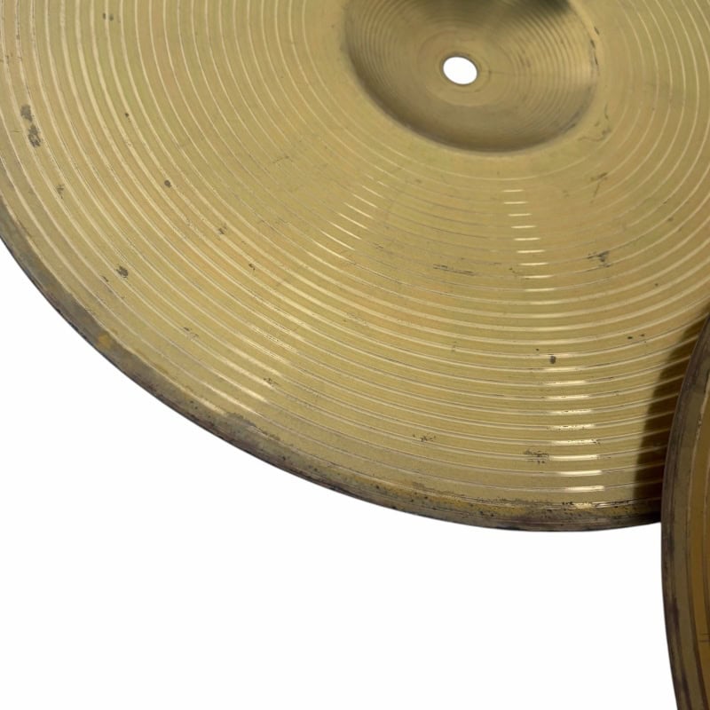 Vintage cymbal with detailed grooves and patina, ideal for percussion and drumming enthusiasts.