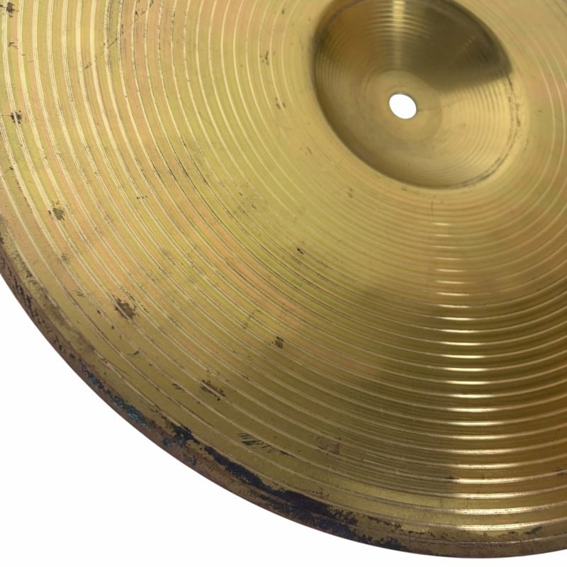 Gold cymbal for drummers, close-up shot of a vintage drum cymbal.