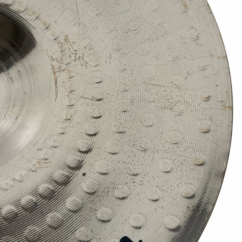 Close-up of a textured drum practice pad with detailed surface patterns for drumming practice.