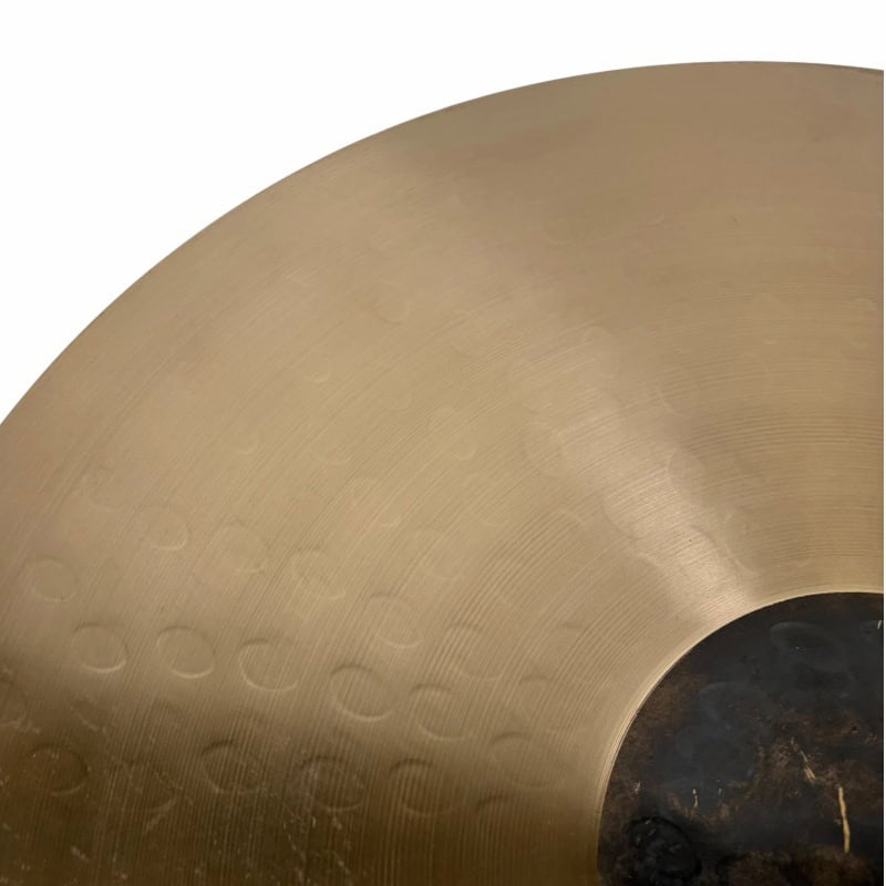 Close-up of Sabian HHX 21in Raw Bell Dry Ride cymbal surface details.