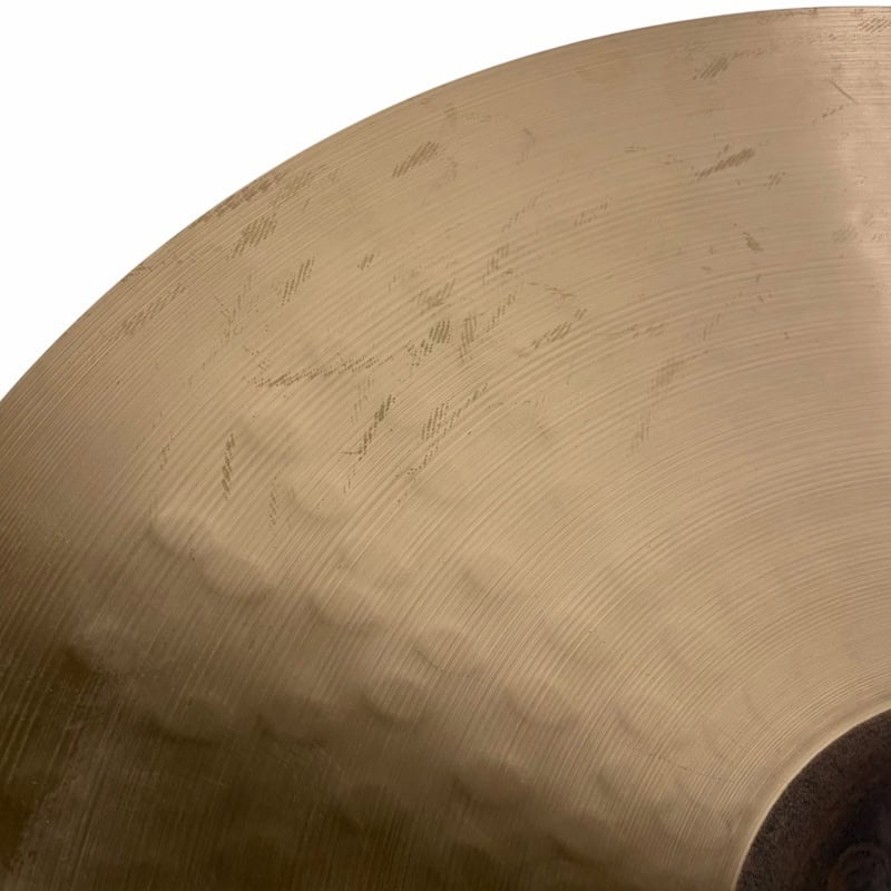 Close-up of Sabian HHX 21in Raw Bell Dry Ride cymbal surface details.