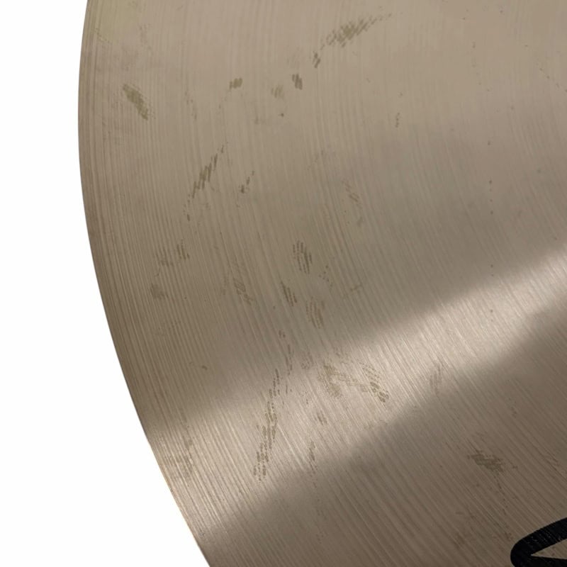 Close-up of Sabian HHX 21in Raw Bell Dry Ride cymbal surface details.