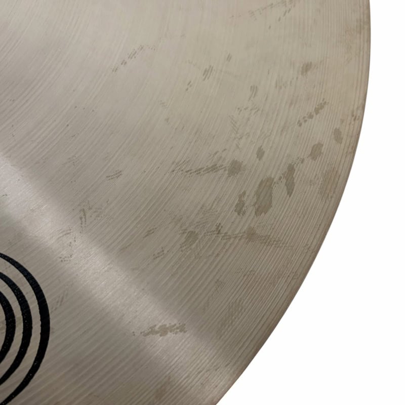 Close-up of Sabian HHX 21in Raw Bell Dry Ride cymbal with surface marks.