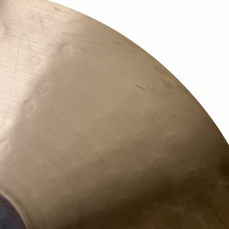 Close-up of Sabian HHX 21in Raw Bell Dry Ride cymbal surface details.