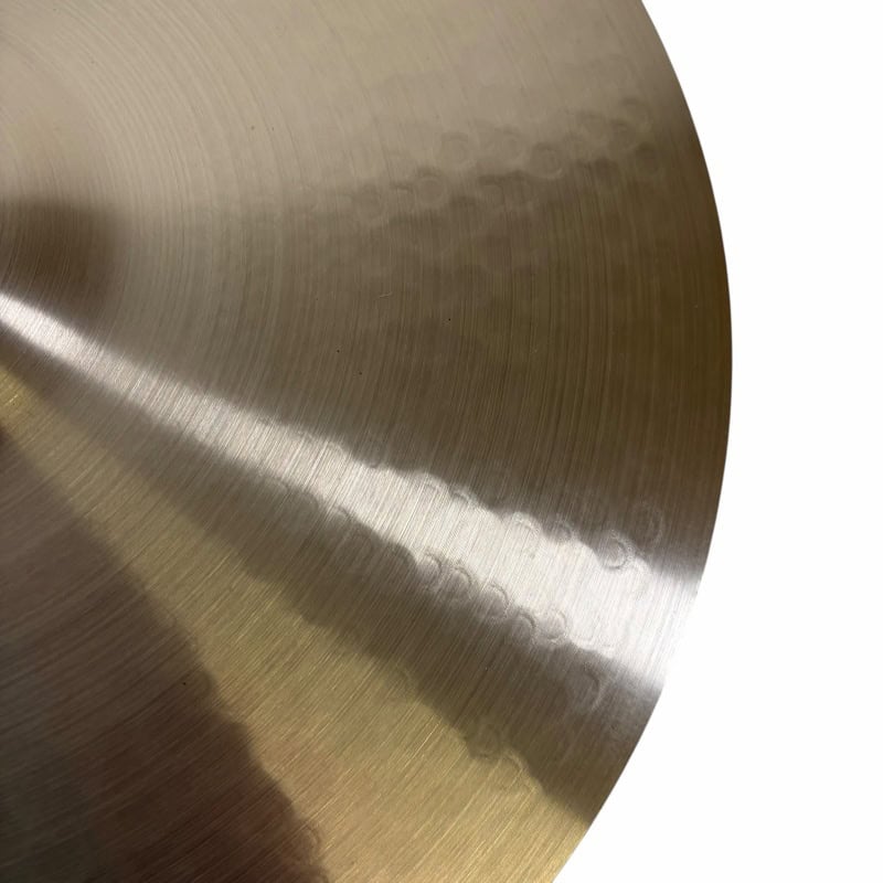 Close-up of a Meinl 16-inch thin crash cymbal showing its metallic surface and subtle grooves.