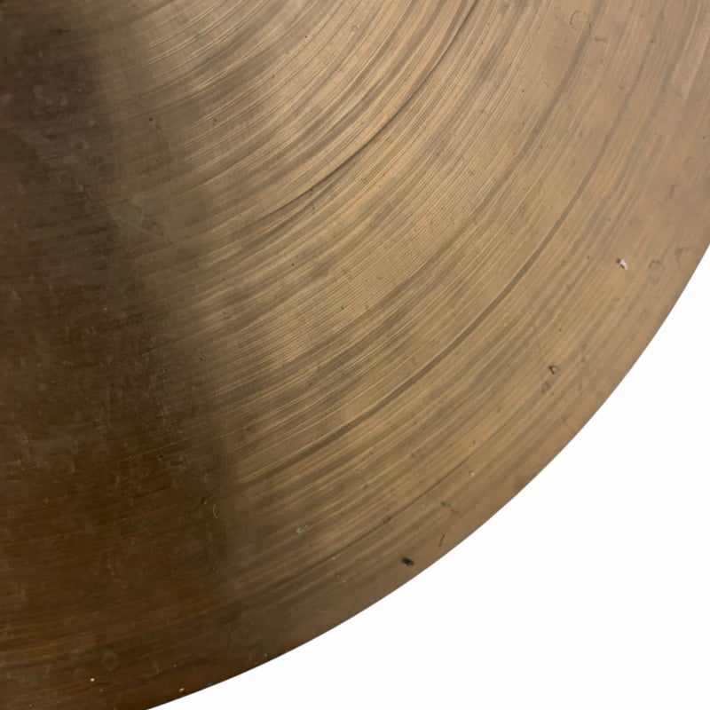 Close-up of a bronze UFIP crash cymbal with detailed grooves.
