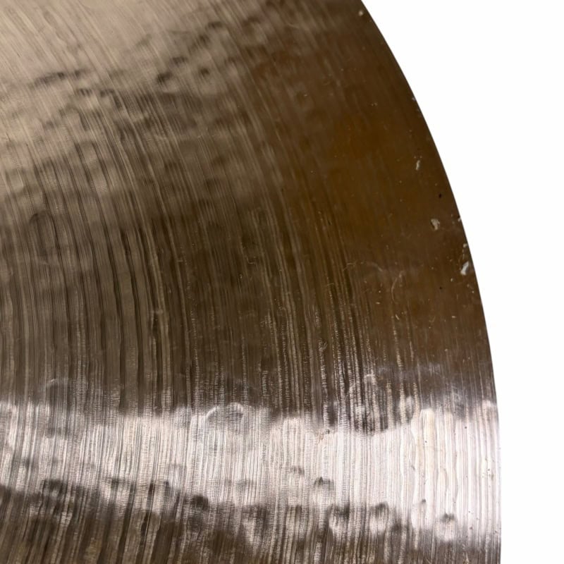 Close-up of Sabian 22in Artisan Ride cymbal with detailed grooves and finish.