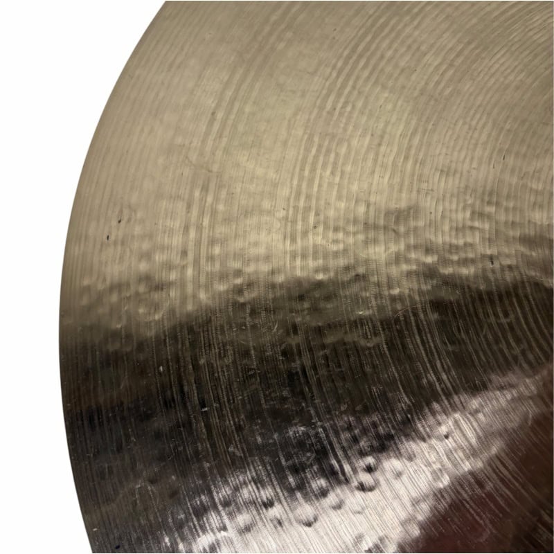 Close-up of Sabian 22in Artisan Ride cymbal showing detailed surface texture.
