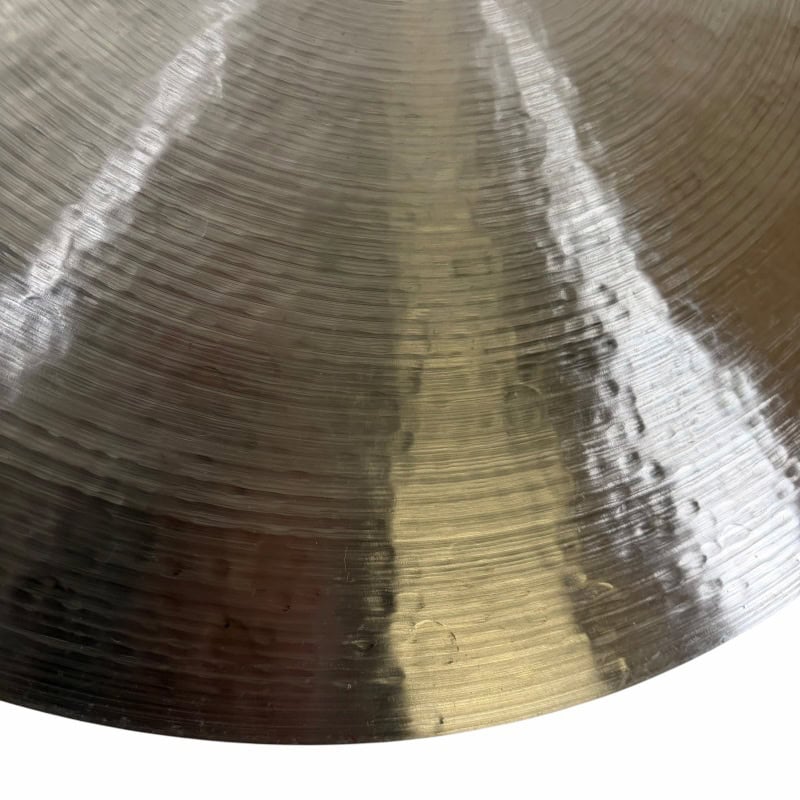 Close-up of Sabian 22in Artisan Ride cymbal with detailed grooves.
