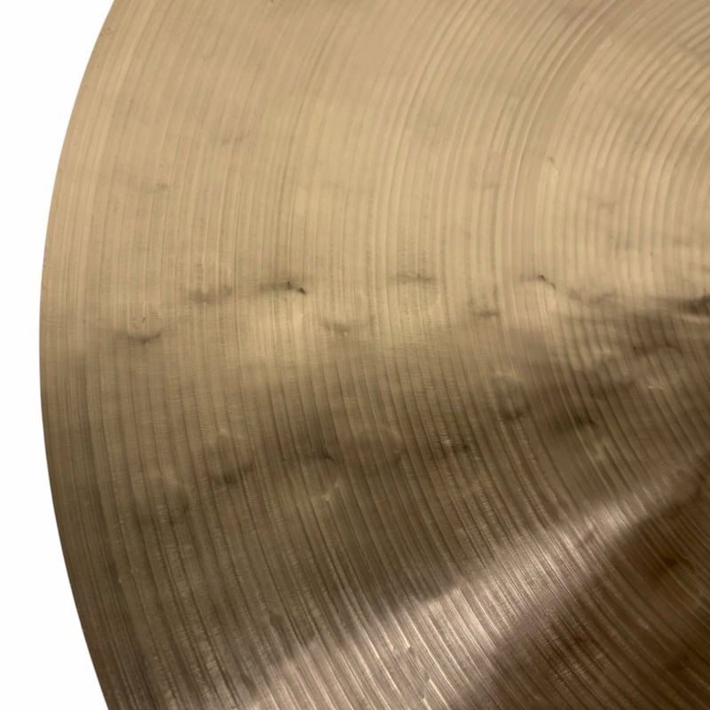 Close-up of Sabian 22-inch Artisan Ride cymbal with detailed grooves.