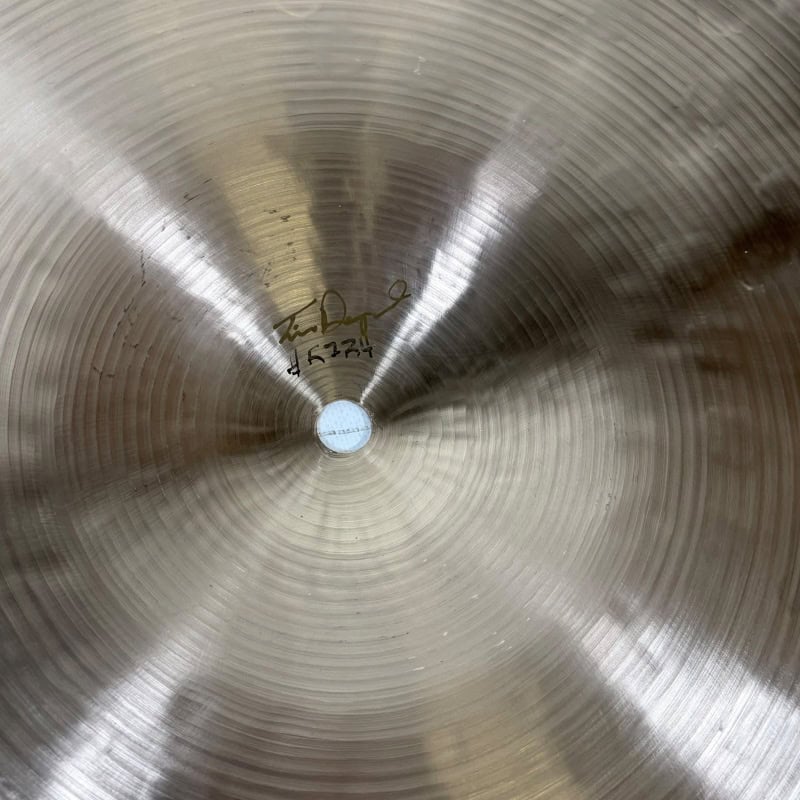 Close-up of Sabian 22in Artisan Ride cymbal with detailed surface.