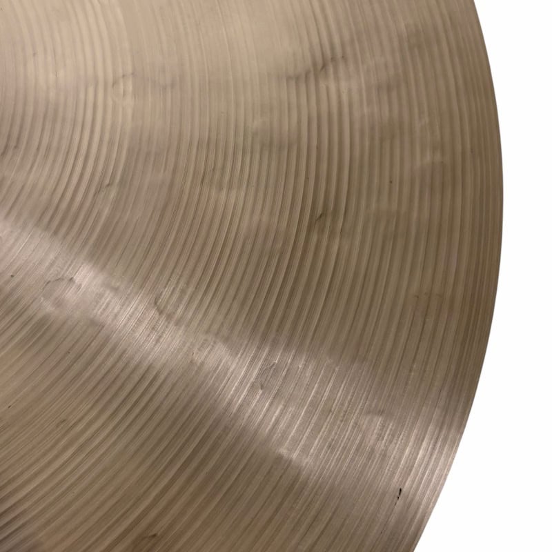 Close-up of Sabian 22in Artisan Ride cymbal with detailed grooves.
