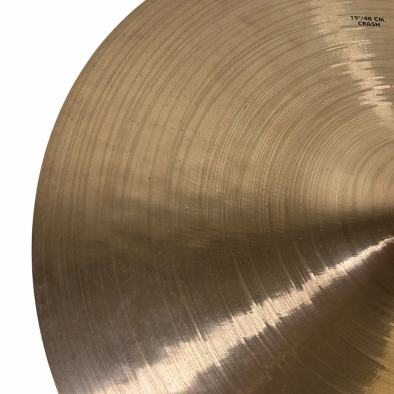 Close-up of a 19-inch UFIP crash cymbal with detailed grooves.