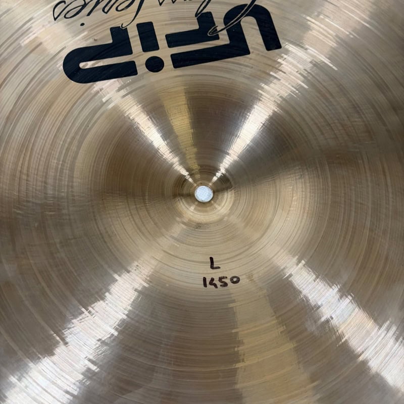 Close-up of a UFIP 19-inch crash cymbal with branding and markings.