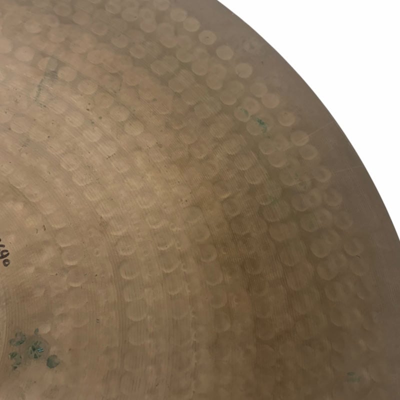 Close-up of UFIP Natural Series 22in ride cymbal showing textured surface.