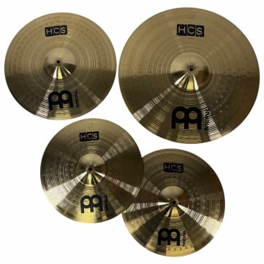 Set of four Meinl HCS cymbals for drum kit, gold finish, close-up view.