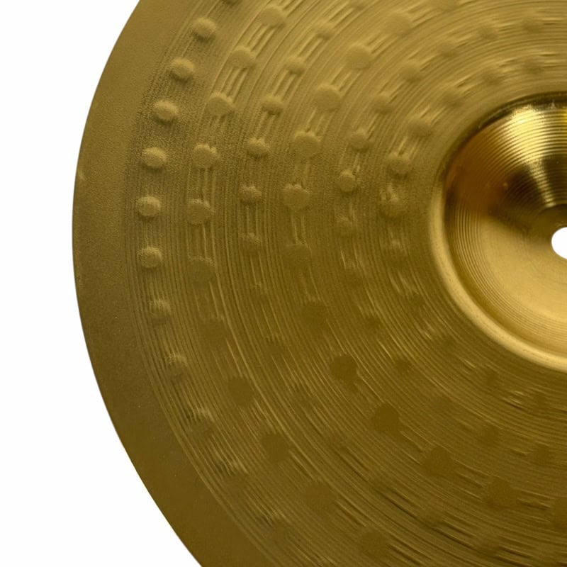 Close-up of a Meinl HCS cymbal showing detailed surface texture and branding.