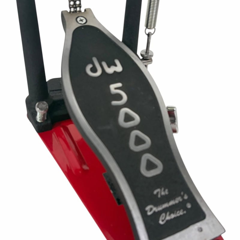 Close-up of DW 5000 bass drum pedal with black and silver finish.