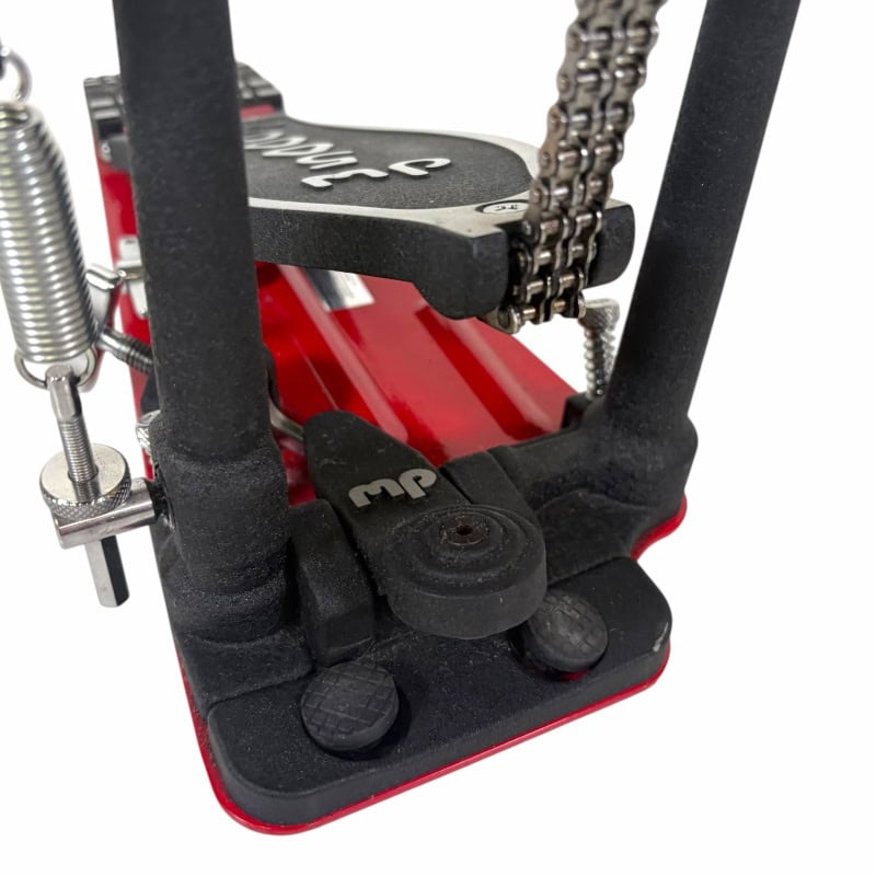 Close-up of DW 5000 single bass drum pedal with chain drive and footplate.