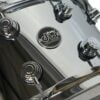Close-up of Drummers Only logo on a shiny drum kit surface.