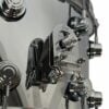 Close-up of professional drum kit hardware and cymbal stands.