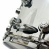 Close-up of a professional drum kit with chrome hardware and drumsticks.