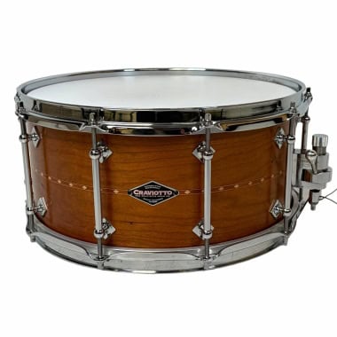 High-quality wooden snare drum with chrome hardware for percussionists.